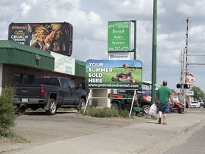 Prairieland Rental and Sales is one business with a portable sign near a billboard. The City of Regina has proposed changes to their portable sign bylaw, which would force portable signs to be at least 30 metres from a billboard.