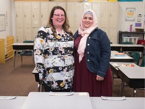 Grade 4 classroom teacher and researcher Kari Krug, left, and islamic studies teacher Asmaa Olwan stand together in Krug's classroom at Regina Huda School. Krug is working on a project to create more understanding and a better sense of belonging between Muslim and non-Muslim staff. Olwan is a research participant.
