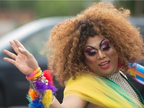 REGINA, SASK : June 15, 2019  -- A participant waves during the Pride parade as it made its way down Broad Street. BRANDON HARDER/ Regina Leader-Post