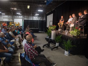 Viewers look on while (from left on stage) Nick Cornea of Farmers Against Rural Crime, Saskatchewan Association of Rural Municipalities president Ray Orb, moderator Jim Smalley, RCMP S/Sgt. Devin Pugh and lawyer Talon Regent sit together as a panel discussing the issue of rural crime during Canada's Farm Progress Show held at Evraz Place.