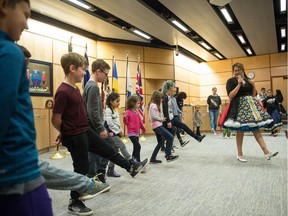 The Creeland Dancers teach children a step from the Red River Jig at Regina City Hall during National Indigenous Peoples Day.