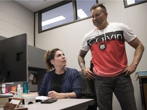 Regina Police Service clinical psychologist Danielle DeSorcy, left, and Sgt. Darren Finkledey work in the RPS's Serious Violent Offender Response (SVOR) program.