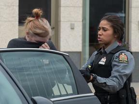 ** BEST PHOTO ** REGINA, SASK : June 27, 2019  -- Former Regina businesswoman Alena Marie Pastuch, left, leaves Regina's Court of Queen's Bench in custody after being found guilty on charges of theft, fraud and money laundering. BRANDON HARDER/ Regina Leader-Post