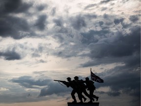 A view of the new British memorial to the Second World War Normandy landings by sculptor David Williams-Ellis, is silhouetted along Gold beach at Ver-sur-Mer on June 6, 2019, as part of D-Day commemorations marking the 75th anniversary.