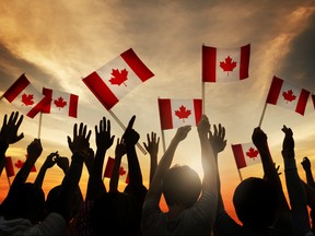 Crowd Holding Canadian Flags