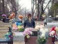 Marie-France Guerrette sits at the grave of her mother, Mona. Marie-France has created a documentary, Unmothered (Sans Maman) about losing her mother to cancer in 1995, when Marie-France was 13 years old. It is screening in Regina on June 17, 2019.
