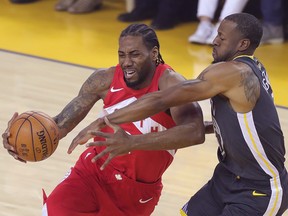 Toronto Raptors forward Kawhi Leonard (2) drives to the basket while Golden State Warriors forward Andre Iguodala (9) defends during Game 4 of the NBA Finals at Oracle Arena. (Sergio Estrada-USA TODAY Sports)