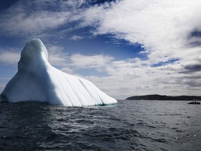 Trinity Eco-Tours take tourists up close to an iceberg in Bonavista Bay, Newfoundland and Labrador on Monday, June 11, 2019.THE CANADIAN PRESS/Paul Daly