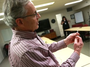 Dr. Peter Butt demonstrates how to use a Naloxone kit.