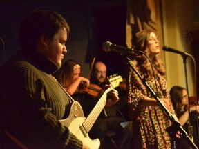 Andy Beisel (left) plays guitar as "Stoneface Stanley" and Brittany Muir sings as "Mitsy Muller" in Wolf Willow.