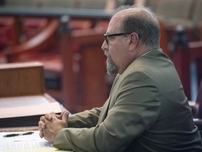 John F. Russo appears for a disciplinary hearing on July 9, 2019.