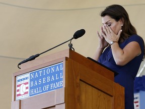 Brandy Halladay speaks on behalf of her late husband, Roy Halladay, during the Baseball Hall of Fame induction ceremony at Clark Sports Center on Sunday. (GETTY IMAGES)
