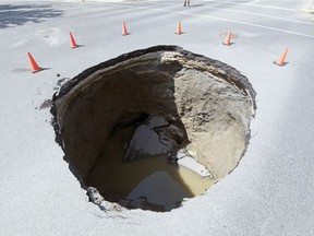 A large sink hole appeared at the intersection of Elphinstone Street and Avonhurst Drive on Canada Day in Regina.