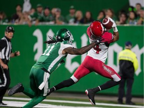 Eric Rogers, 4, of the Calgary Stampeders catches a touchdown pass against the Saskatchewan Roughriders' Ed Gainey on Saturday at Mosaic Stadium.