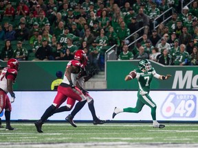 Saskatchewan Roughriders quarterback Cody Fajardo prepares to throw a pass while rolling to his right Saturday against the visiting Calgary Stampeders. The pass was intercepted and returned 48 yards for a touchdown by Tre Roberson.
