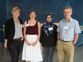 From left, University of Texas research scientist Katherine Romanak, student Anne Streb, student Saira Waheed and Tim Dixon, general manager of the IEA Greenhouse Gas R&D Programme stand in the University of Regina Research and Innovation Centre building where a Carbon Capture and Storage Summer School was being held.