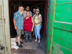 Staff of Indigenous Christian Fellowship on Dewdney Avenue, from left, Bert Adema, Matthew Krohn, Betty Krohn, Wilfred Dieter and Tiffany Keewatin, stand in a sea can that contains repaired bicycles ready to be donated to the community.
