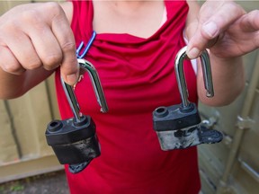 Betty Krohn of Indigenous Christian Fellowship on Dewdney Avenue holds up locks similar to those that were cut to gain access to the organization's sea can, from which a number of bicycles for donation and a set of winter tires were stolen.