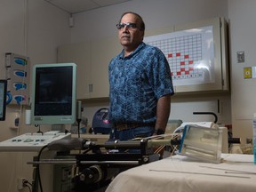 Dr. Asim Amjad, a radiation oncologist at the Saskatchewan Cancer Agency, stands amidst the equipment used in brachytherapy for the treatment of prostate cancer at the Allan Blair Cancer Centre in the Pasqua Hospital.