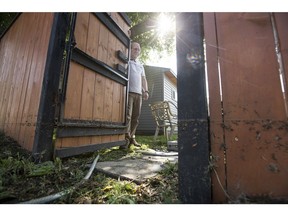 Bill Alto, who lives in a part of Saskatoon that lies within a known flood zone, stands for a photograph at his back fence, where a line of debris is visible from heavy rain on the weekend, in Saskatoon, SK on Monday, July 15, 2019.