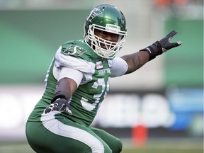 Saskatchewan Roughriders defesnive lineman Charleston Hughes celebrates knocking  the ball loose from B.C. Lions quarterback Mike Reilly in first half CFL action at Mosaic Stadium on July 20.