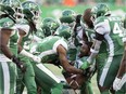 Saskatchewan Roughriders defensive back Loucheiz Purifoy, shown without a helmet,  celebrates his interception Saturday against the visiting B.C. Lions. Purifoy's pick set up a Roughriders touchdown in their 38-25 victory.