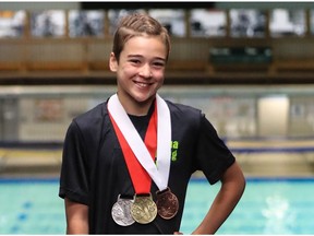 Lila Stewart of the Regina Diving Club is shown with her three medals at the Speedo Junior Development Nationals, which ran from Thursday to Sunday at the Lawson Aquatic Centre.