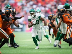 Saskatchewan Roughriders tailback William Powell runs through a huge hole for some of the 146 yards he gained in Saturday's 45-18 victory over the host B.C. Lions.