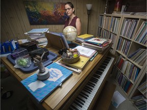 Irene Lacoursiere, a lifelong piano player and a well-known accompanist who in 2017 suffered a head injury and concussion that subsequently has made the sounds of a piano cause her to become physically ill, stands for a photograph near her piano at her home in Saskatoon, SK on Monday, July 15, 2019. Lacoursiere stated she moved her piano into her basement over a year ago, as she is no longer able to play and the sight of it brings her sadness.