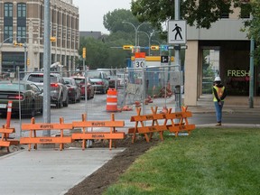 Traffic backs up as construction work continues along Victoria Avenue, ending as the street intersects Albert Street. The Fresh and Sweet cafe can be seen on the right.