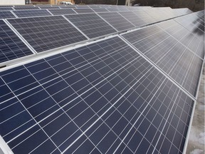 Solar panels atop a roof in Saskatoon.