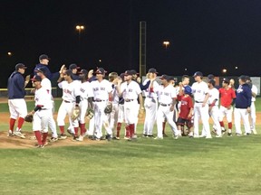 The Regina Red Sox celebrate at Currie Field on Monday night after clinching first place in the Western Canadian Baseball League's Eastern Division.