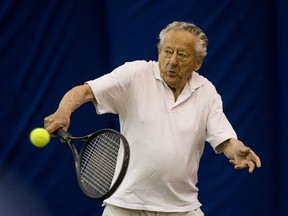 Eli Bornstein, aged 96, returns a serve at the Lakewood Indoor Tennis Centre. His friends in the senior morning league honoured him with a trophy for his dedication to the sport in Saskatoon, SK on Wednesday, August 7, 2019.