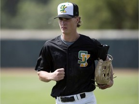 Saskatchewan's Kendall Keller jogs in from the outfield during a game against B.C. at the Baseball Canada Cup in Regina on Friday.