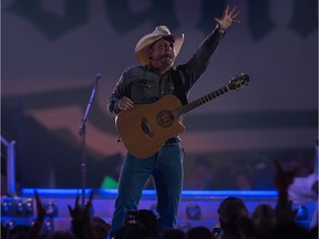 Garth Brooks plays at Mosaic Stadium after the concert was delayed for three hours by bad weather.