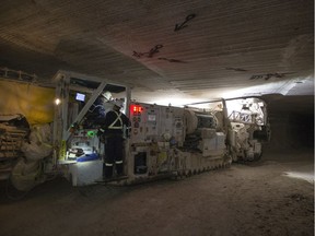 A Nutrien employee operates a miner, a machine use to dig though rock, in a potash mine shaft during a media tour at the Nutrien Cory Mine near Saskatoon, SK on Monday, August 12, 2019.