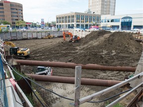 Equipment sits in the Capital Pointe site, where the hole is more than 70 per cent filled.