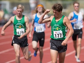 Team Saskatchewan's Ron MacLean, from Regina, celebrates after winning the male 1,500-metre race in athletics at the Western Canada Summer Games in Swift Current on Thursday.