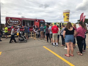 A crowd lines up at the Prairie Smoke & Spice BBQ food truck at the Food Truck Wars rematch hosted by the Centennial Market on Sunday, Aug. 18 in Regina.