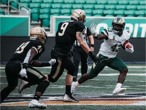 Odun Ogidan of the University of Regina Rams carries the ball during Wednesday's Canada West exhibition game against the University of Manitoba Bisons at Mosaic Stadium.