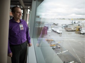 James Bogusz, president and CEO of Regina Airport Authority, looks out at the tarmac at Regina International Airport.