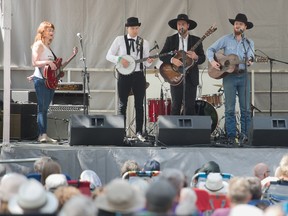 From left, Megan Nash, Colton Crawford, Nate Hilts and Colter Wall, who shared the stage with Amanda Shires, not shown, perform during the Regina Folk Festival in Victoria Park on Aug. 10, 2019.