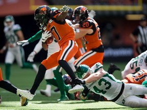 The B.C. Lions' Ryan Lankford, 17, evades a tackle by the Saskatchewan Roughriders' Micah Teitz, 43, during a July 27 game in Vancouver.