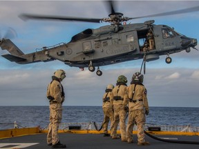 HMCS REGINA's Air Detachment and the CH-148 helecopter "BRONCO" train on hoisting and in air refueling during Operation PROJECTON in the Pacific Ocean on August 2 2019. (Photo by Cpl. Stuart Evans, courtesy of the Royal Canadian Navy)
