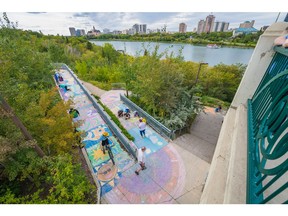 Participants contribute to the Meewasin Valley Authority's attempt at breaking the world record for the longest sidewalk chalk mural in Saskatoon, SK on Saturday, August 31, 2019.