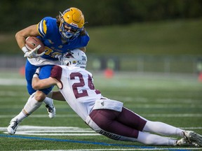 Regina's Brandyn Martin puts the clamps on Saskatoon Hilltops' receiver Carter Norrish Saturday at SMF Field.