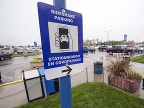 New signs at the Regina International Airport point to ride share parking stalls outside of the arrival doors in Regina.