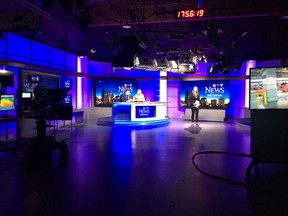 Lee Jones and Heather Anderson, seated at the anchor desk, prepare for their supper-hour newscast while Taylor Rattray, far right, is on-air in the CTV Regina studio.