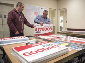 Campaign manager Shawn McEachern, left, and Liberal Ralph Goodale put together campaign signs at their office in Regina.