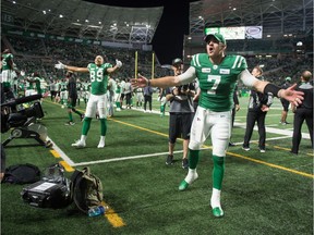 Saskatchewan Roughriders quarterback Cody Fajardo, 7, and receiver Brayden Lenius, 89, call for fans to make noise during the dying seconds of Saturday's game against the visiting Montreal Alouettes.